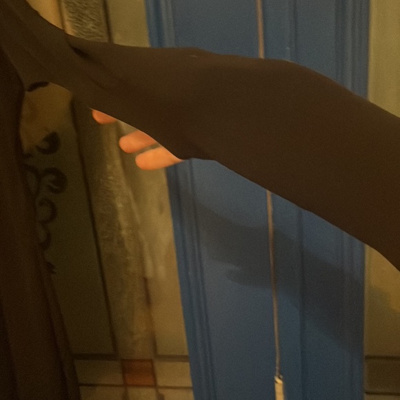 Black sexy mini dress fitted with holes throughout sleeves very unique. - Picture 5 of 5